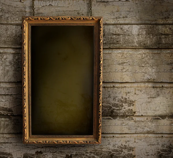 Old frame against a peeling painted wall — Stock Photo, Image
