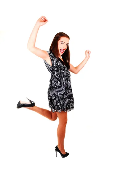 Jong meisje in jurk en hoge hakken dansen. — Stockfoto