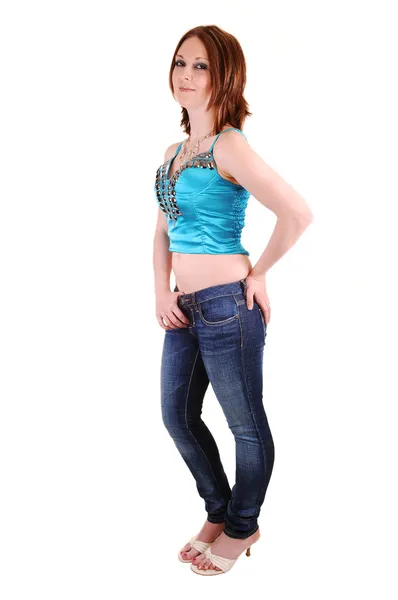 The young girl in jeans and blue top. — Stock Photo, Image