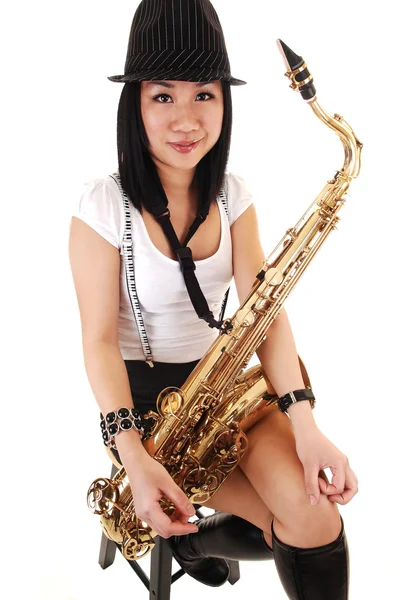 Chinese girl playing the saxophone. — Stock Photo, Image