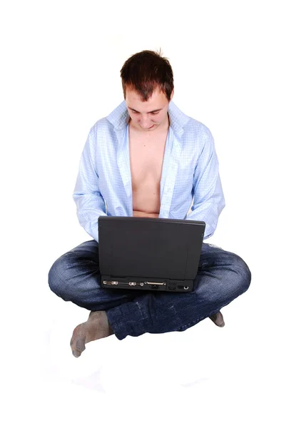 Teen with laptop and open shirt. — Stock Photo, Image
