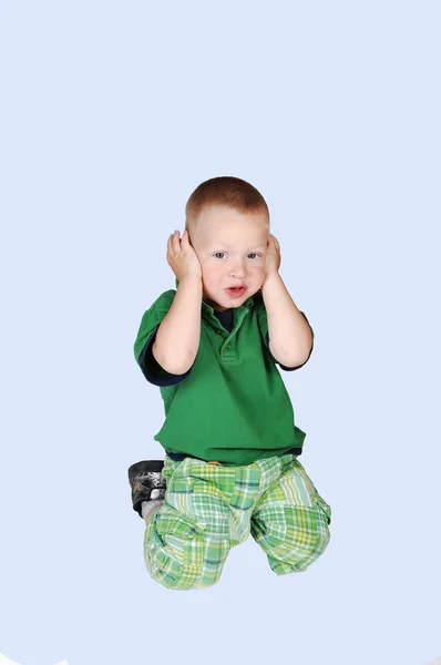Little boy closed his ears. — Stock Photo, Image