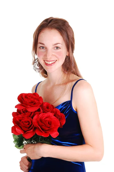 Pěkná dívka s červenými růžemi. — Stock fotografie