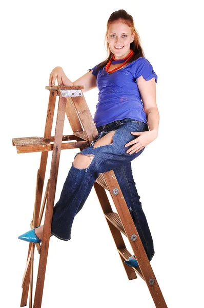 Pretty girl on the stepladder. — Stock Photo, Image