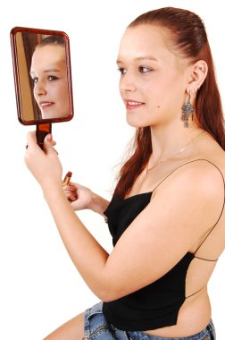 A pretty woman in the mirror. clipart