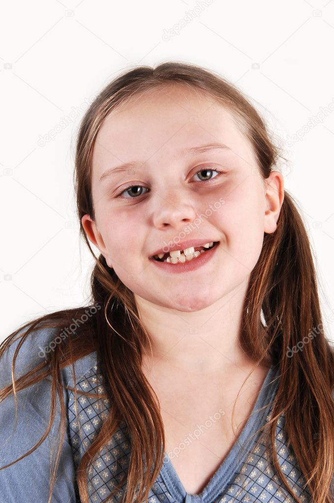 Young girl with missing teethes.