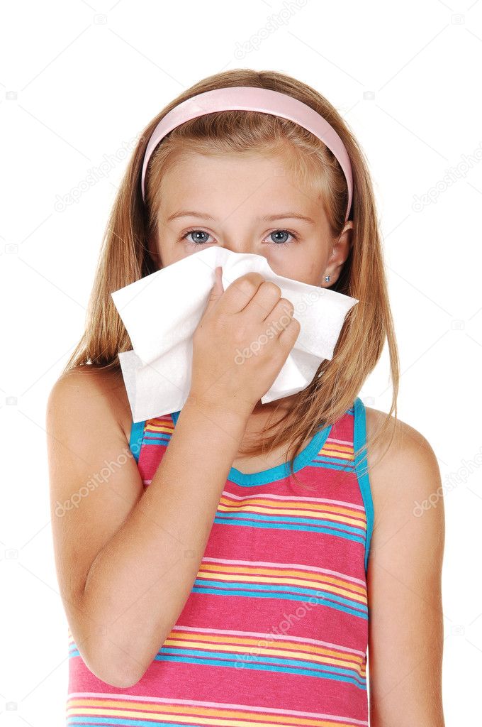 Young girl sneezing.