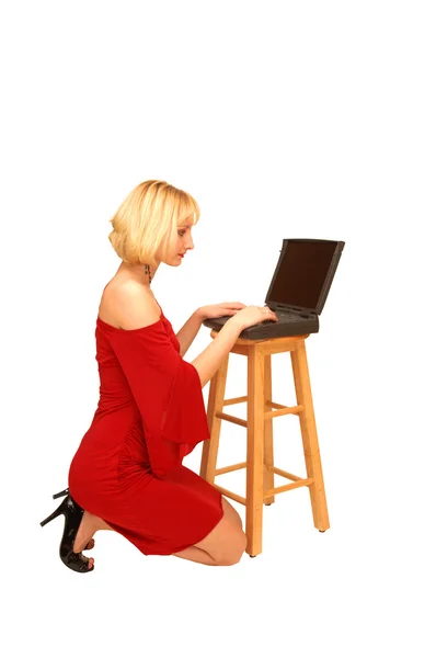 Kneeling blond lady in red dress — Stock Photo, Image