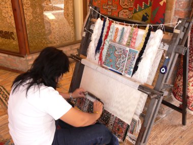 Weaving an carpet. clipart