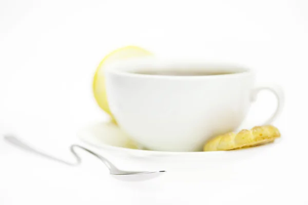 White cup and lemon isolated on white — Stock Photo, Image