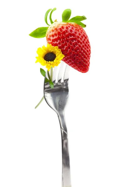 Aardbei en bloem op een vork — Stockfoto