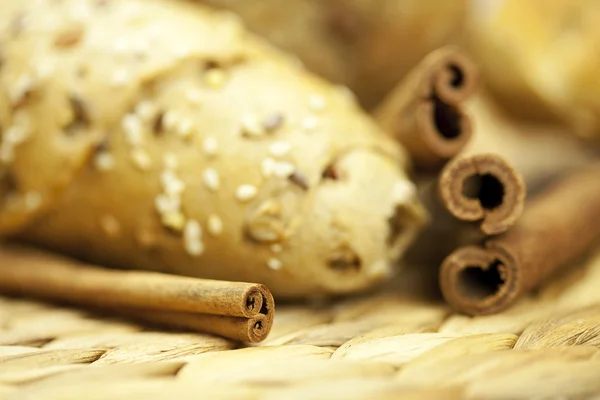 Bread and cinnamon sticks — Stock Photo, Image