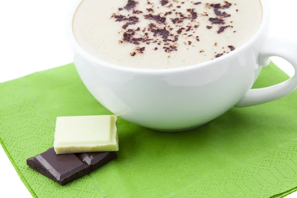 A cup of cappuccino and chocolate — Stock Photo, Image