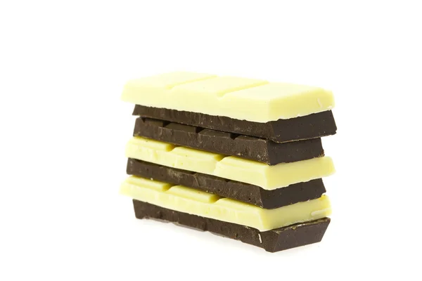 Mountain of white and dark chocolate isolated on white — Stock Photo, Image