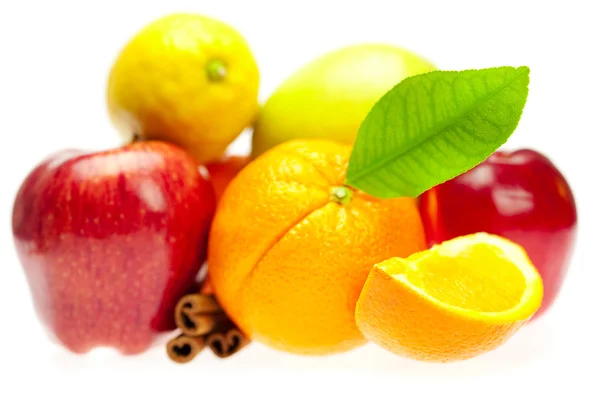 Apple, orange, lemon and cinnamon, isolated on white — Stock Photo, Image