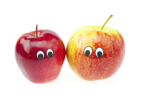 Piada de duas maçãs com olhos isolados em branco — Fotografia de Stock