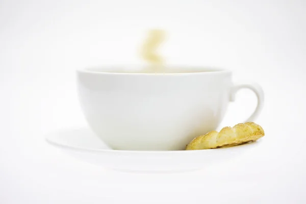 White cup and pastry isolated on white — Stock Photo, Image