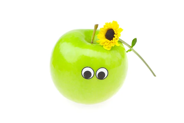 Шутка яблоко с глазами и цветок изолирован на белом — стоковое фото