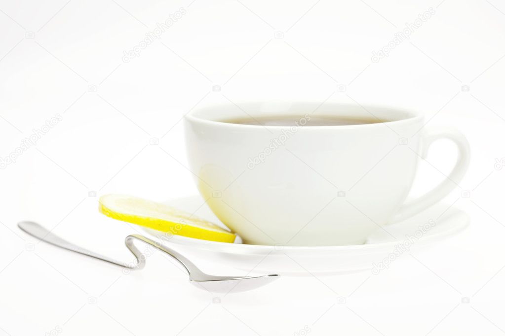 Cup and lemon isolated on white