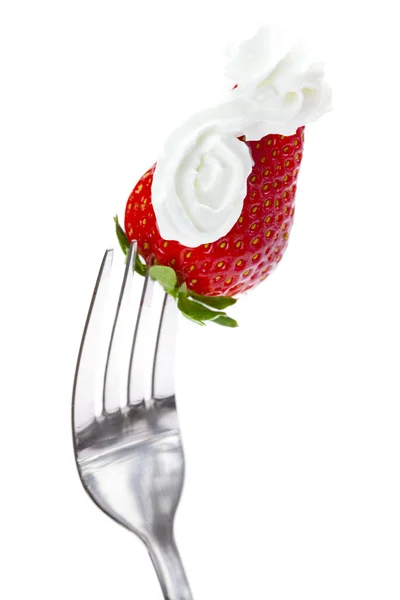 Strawberries with cream on a fork isolated on white — Stock Photo, Image