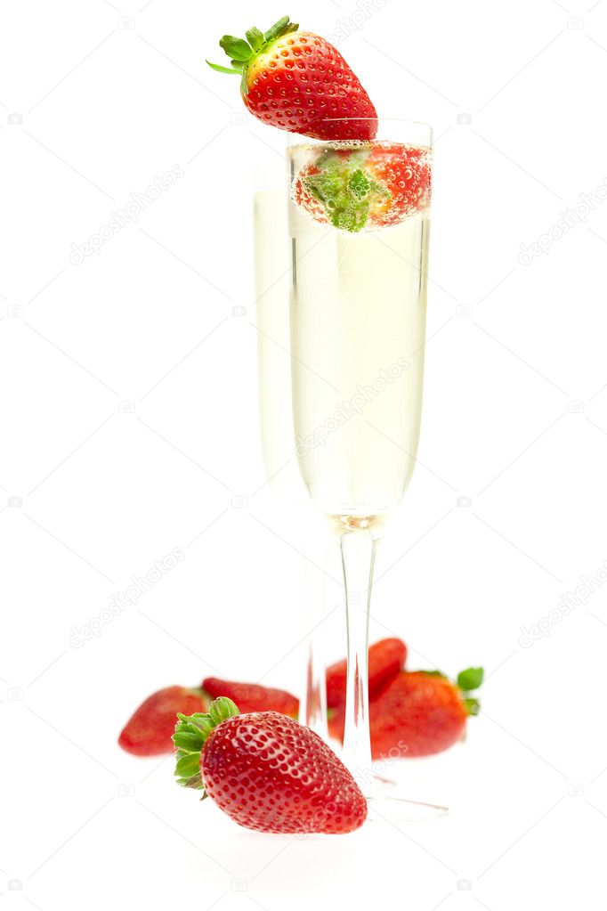 A glass of champagne and strawberries