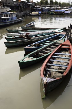 Boats in Jakarta slum clipart