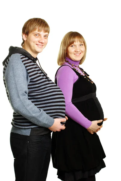妊娠中の幸せな家族は楽しい時を過す — ストック写真