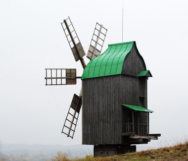 Old windmill with copper roof clipart