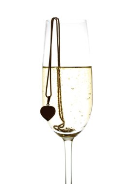 Wineglass with sparkling wine and heart clipart