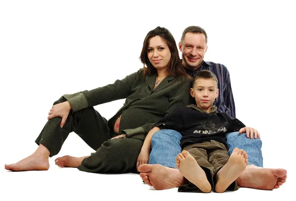 Family with pregnant mother barefoot — Stock Photo, Image