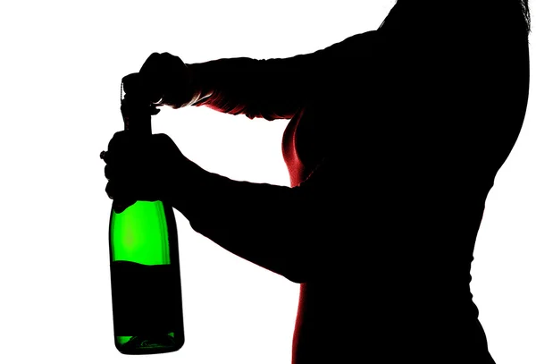 Silhouette of the woman opening champagne — Stock Photo, Image