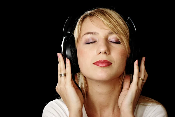 Blonde girl in headphones with eyes closed — Stock Photo, Image