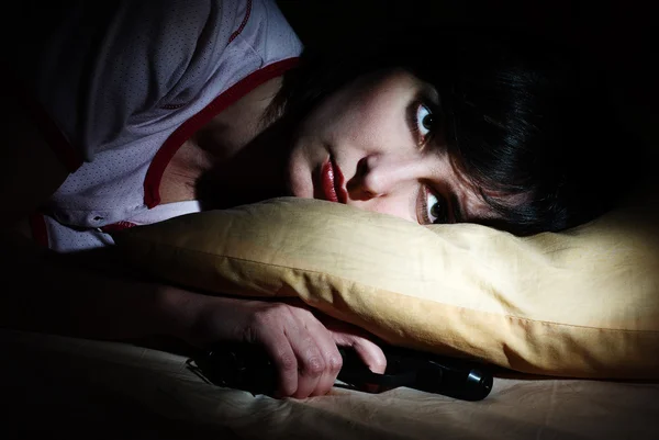 Women awoke with the gun under the pillow — Stock Photo, Image