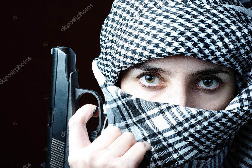 Arab woman in keffiyeh with gun