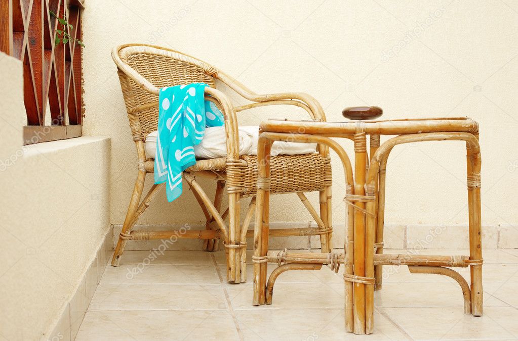 Cane chair and table with forgotten neckerchief