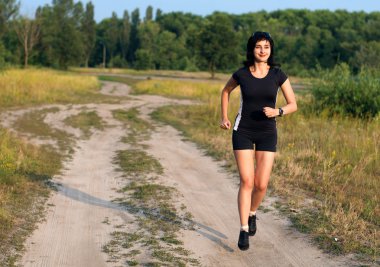 Woman jogging outdoors in summer clipart