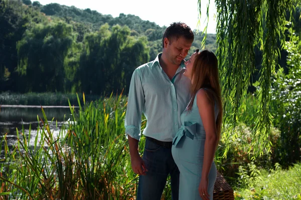 stock image Loving couple on the lake shore