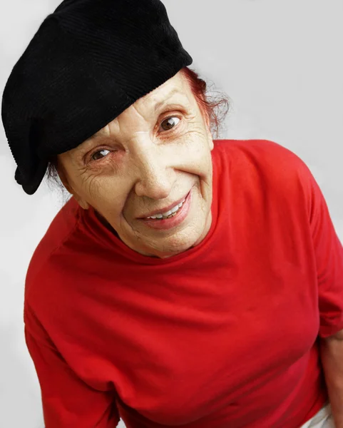 Active grandmama in black cap — Stock Photo, Image