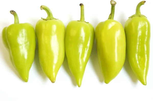 Five green peppers — Stock Photo, Image