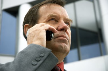 Businessman on phone clipart