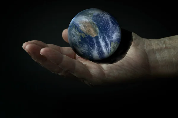 3d Earth on the hand in the dark — Stock Photo, Image