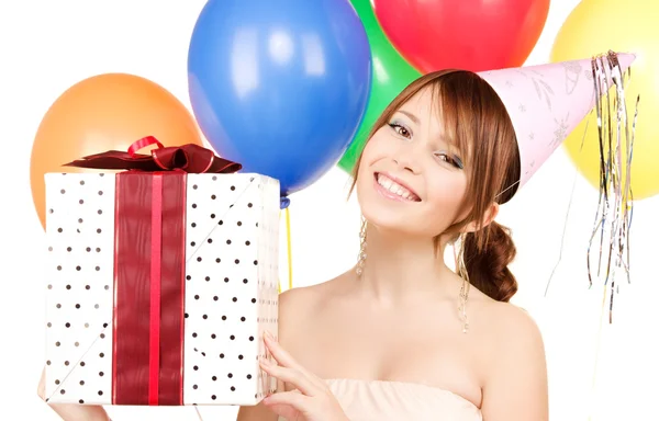 Party girl with balloons and gift box Stock Picture