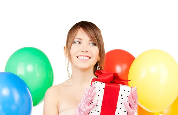 Party girl with balloons and gift box Stock Image