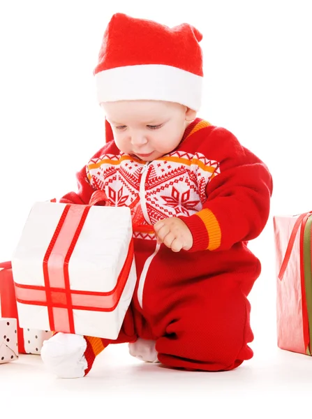 Santa pomocníka dítě s vánoční dárky — Stock fotografie