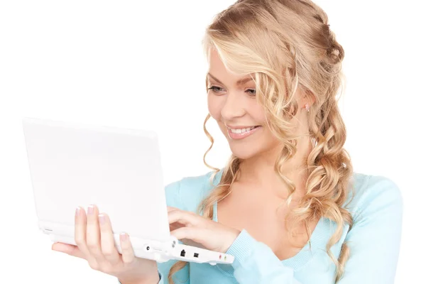 便携式计算机的幸福女人 免版税图库图片