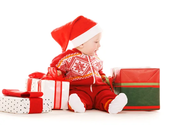 Santa helper baby met giften van Kerstmis — Stockfoto