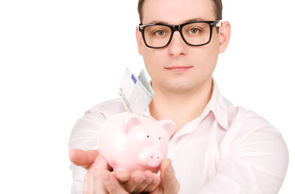 Geschäftsmann mit Sparschwein und Geld — Stockfoto