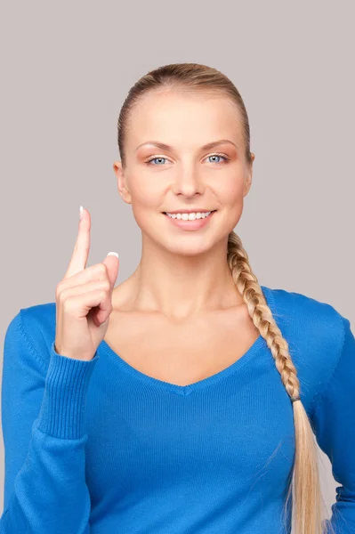Женщина с поднятым пальцем — стоковое фото