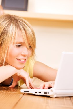 Teenage girl with laptop computer clipart