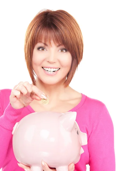 Lovely woman with piggy bank and money — Stock Photo, Image